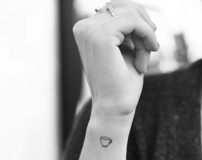 coffee mug, wrist tattoo, black and white photo, inner bicep tattoo