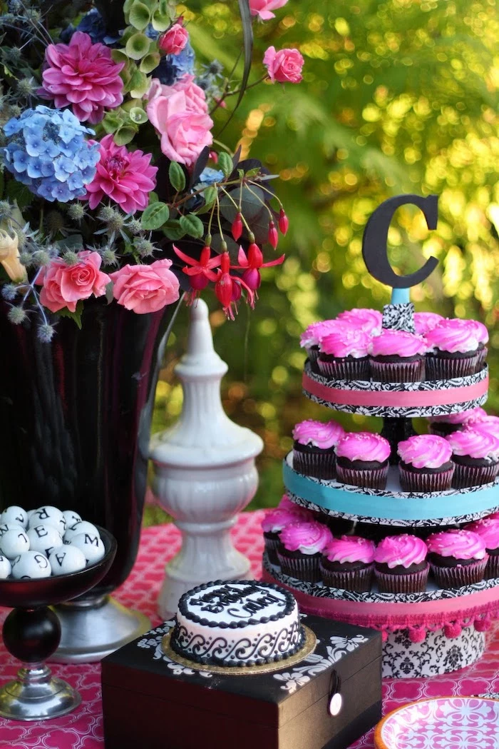 pink frosting, chocolate cupcakes, cupcake stand, colourful flower bouquet, fun games for teens