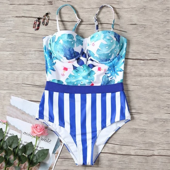 blue and white stripes, floral print, one piece, girls bathing suits, wooden background