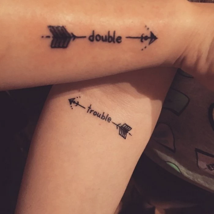 double trouble, arrows on the side, matching tattoo ideas, side arm tattoo, forearm tattoo