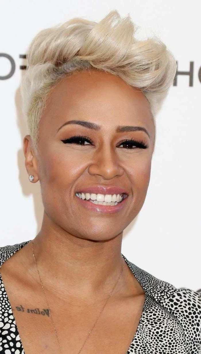 emeli sande smiling, with blonde hair, short natural hairstyles, black and white printed dress