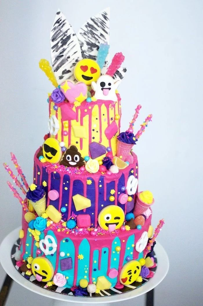 emoji cake, three tier cake, fun games for teens, colourful sprinkles, blue purple and yellow