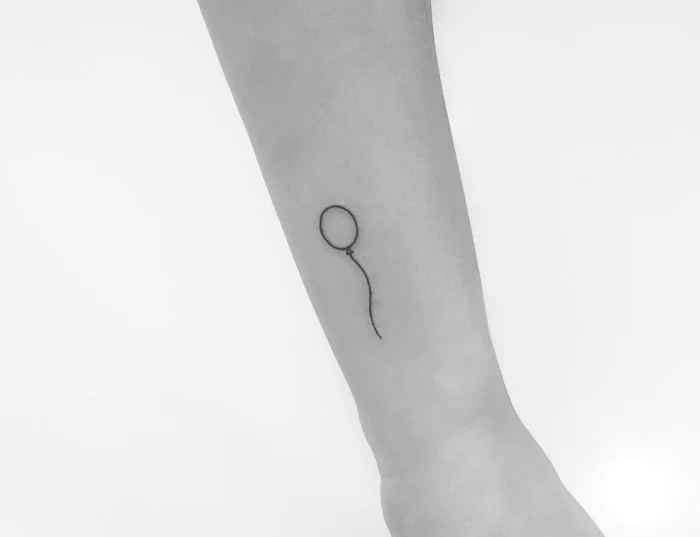 cute little tattoos, floating balloon, side arm tattoo, black and white photo