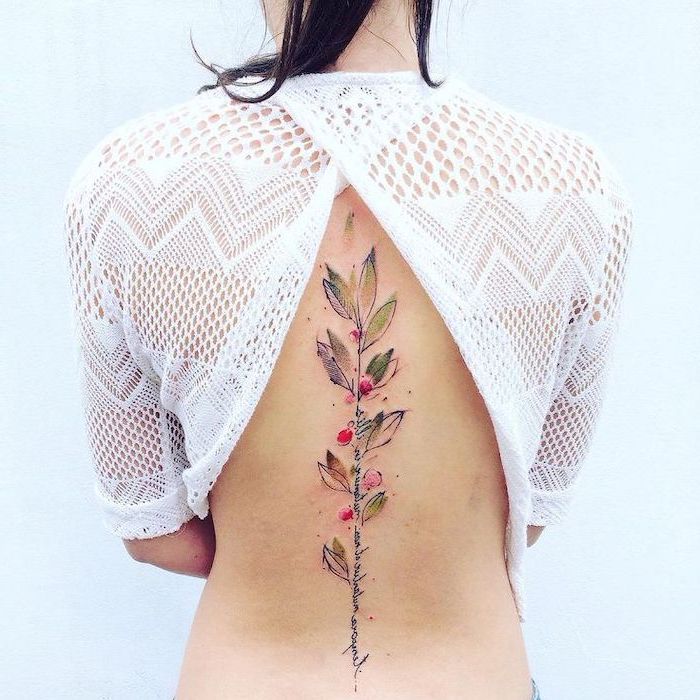watercolor tattoo, along the spine, floral tattoos, white blouse, black hair