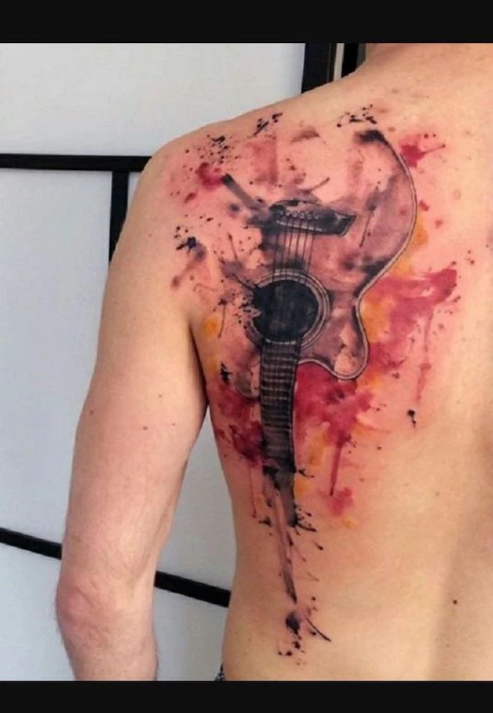 large guitar, watercolour back tattoo, paint splatter tattoo