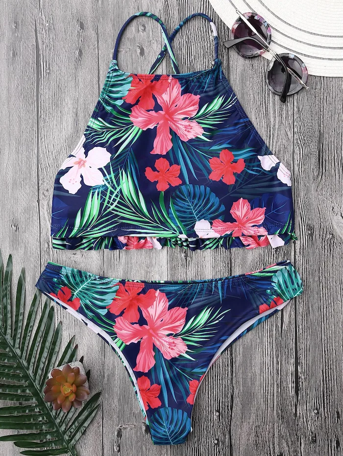 two piece, floral print, bathing suits for teens, wooden background, palm leaf, dark sunglasses