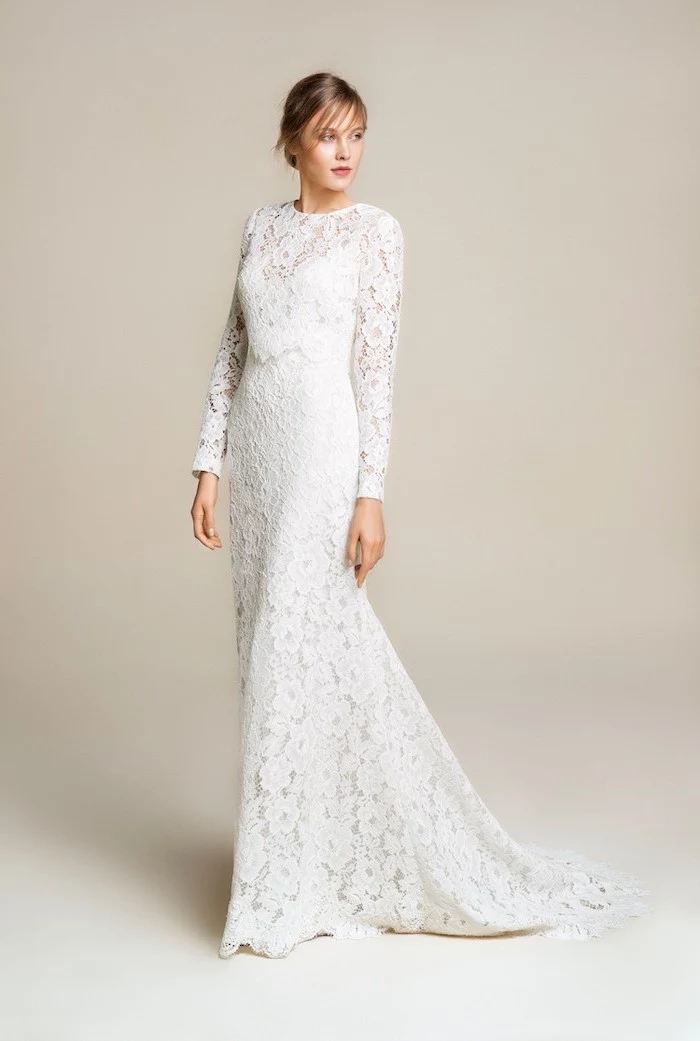 long lace dress, long sleeves, wedding dresses with long trains, blonde hair, in a low updo, with bangs