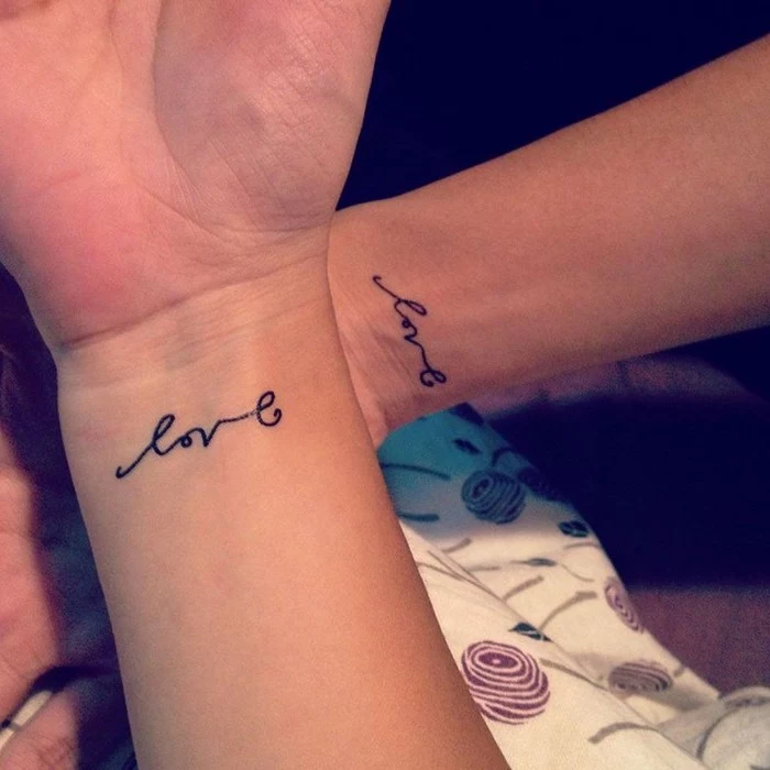 love cursive font, wrist tattoos, matching tattoo ideas, side by side arms