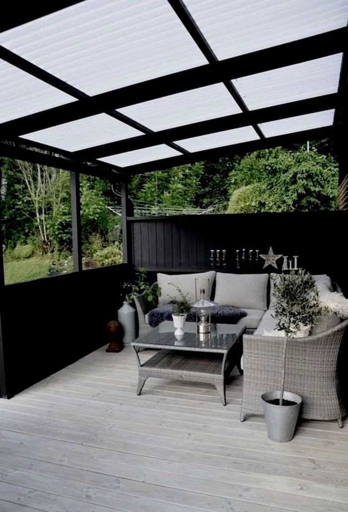 dark wooden porch, garden furniture, porch decorating ideas, grey cushions, potted plants