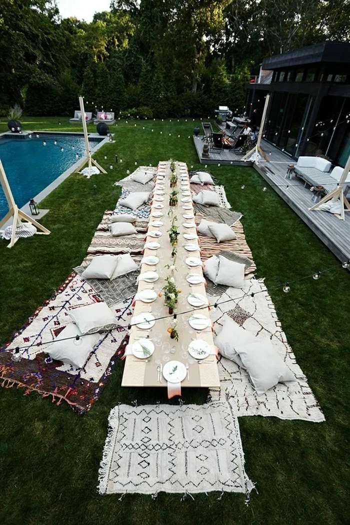 long table, garden party, themes for parties, blankets and pillows, on the grass, next to the pool