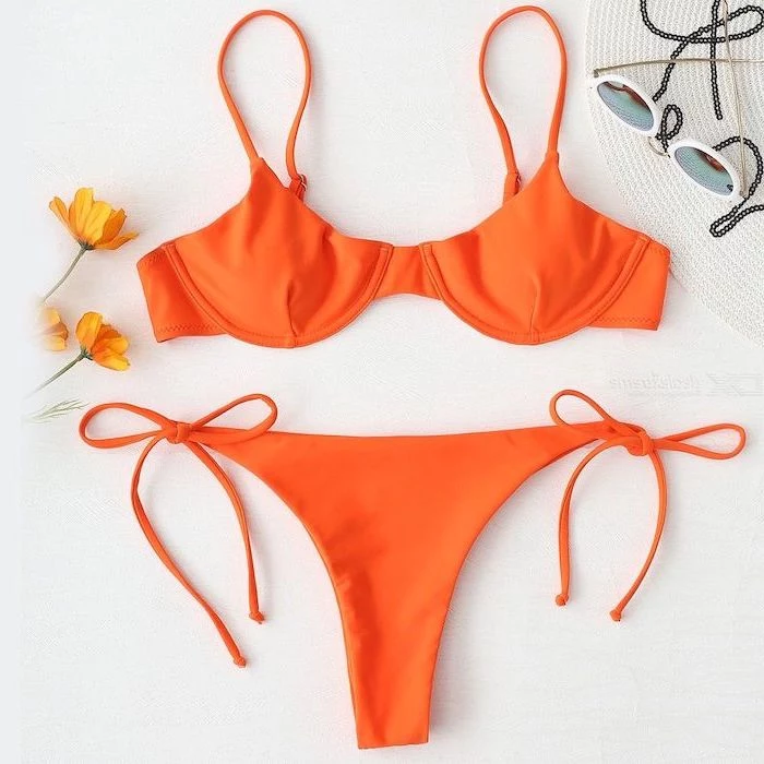 orange two piece, yellow flowers, straw hat and sunglasses, cute bathing suits for girls