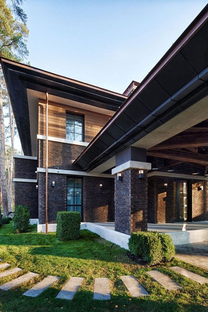 tiled pathway, screened in porch designs, brick columns, small green bushes, green grass