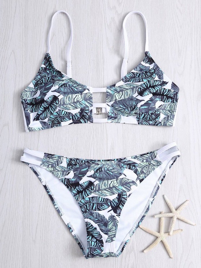 white wooden background, two piece, green palm leaves, floral print, bathing suits for teens