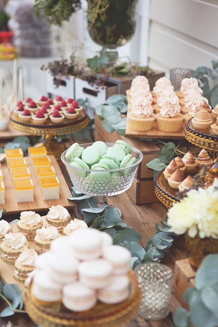 dessert table, green macaroons, fun games for teens, gold cake stands, greenery table runners