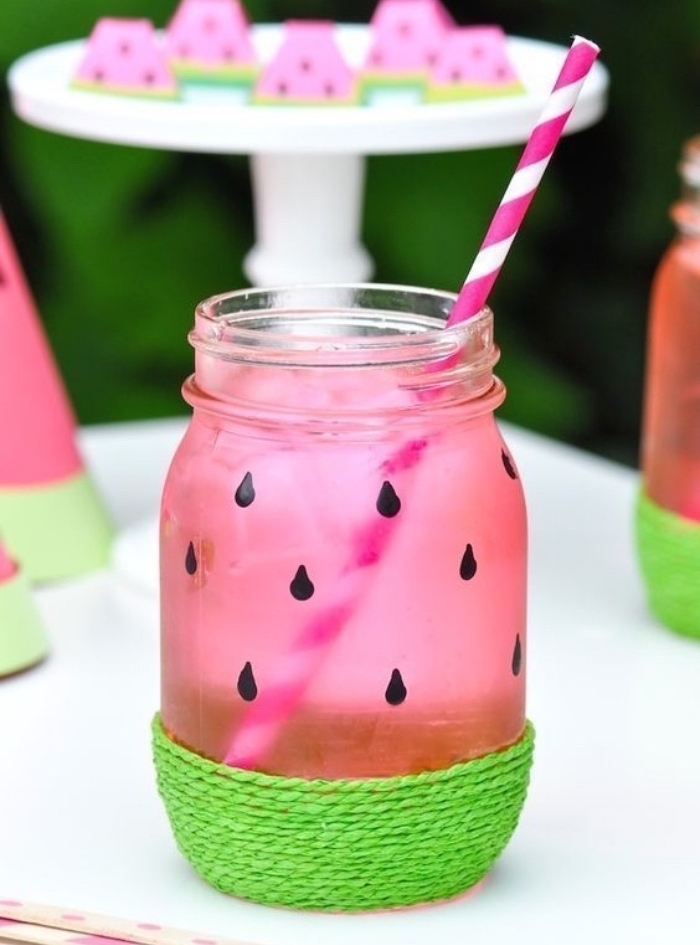 creative things to do when bored, jar painted as a watermelon, green yarn, paper straw