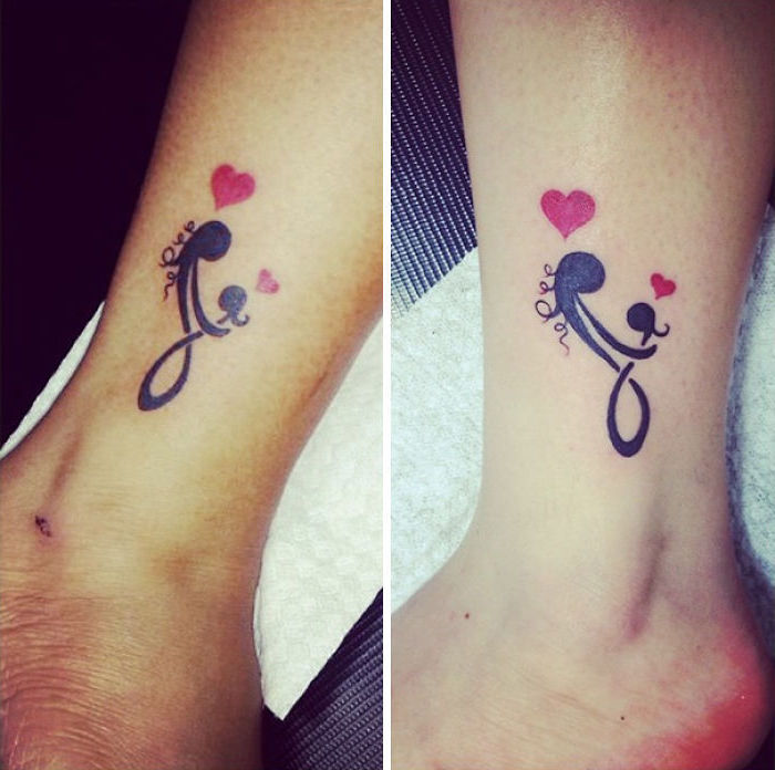 infinity symbol, daughter tattoos, red hearts, female and child silhouettes, leg tattoos
