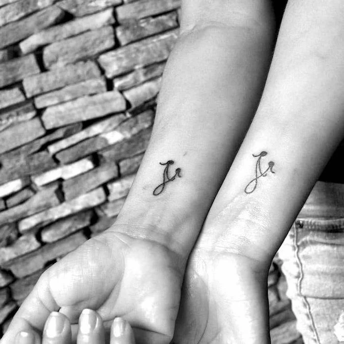 infinity symbol, mother daughter symbol, mother daughter silhouettes, wrist tattoos