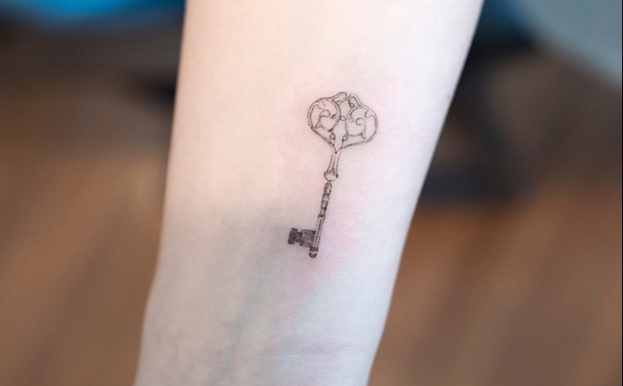 vintage key, tattoo placement ideas, wrist tattoo, blurred background