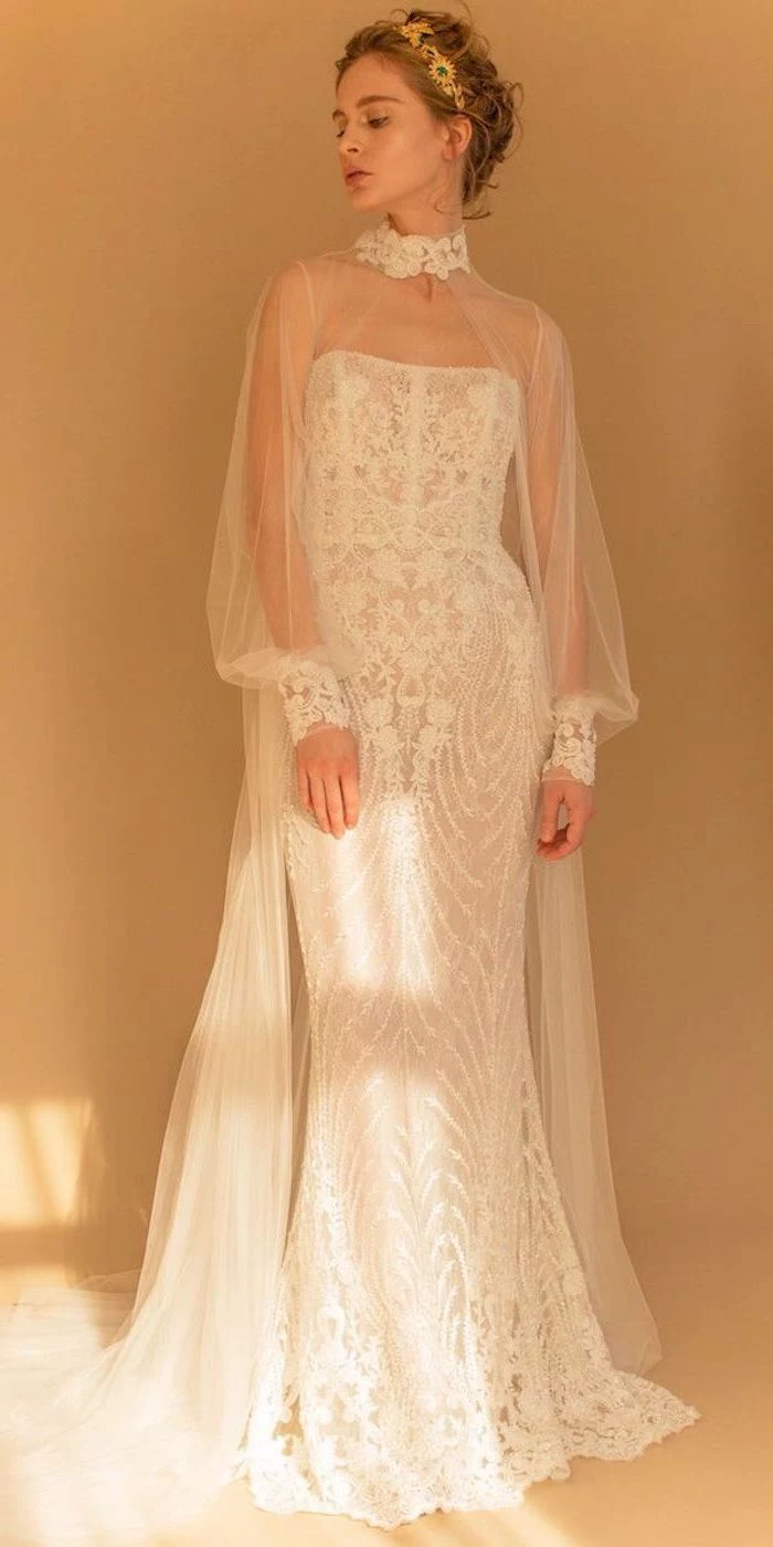 lace wedding dress with cap sleeves, high neck, blonde hair, in a low updo, hair accessory