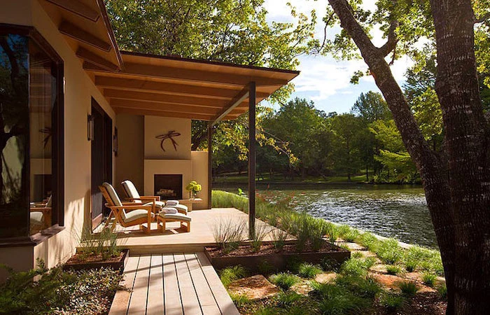 house by the lake, small front porch ideas, wooden armchairs, white cushions