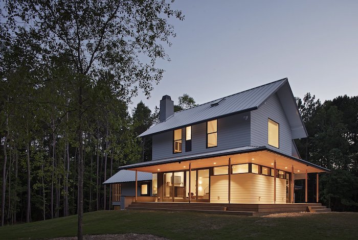 wooden house, surrounded by tall trees, small front porch ideas, lights on the ceiling