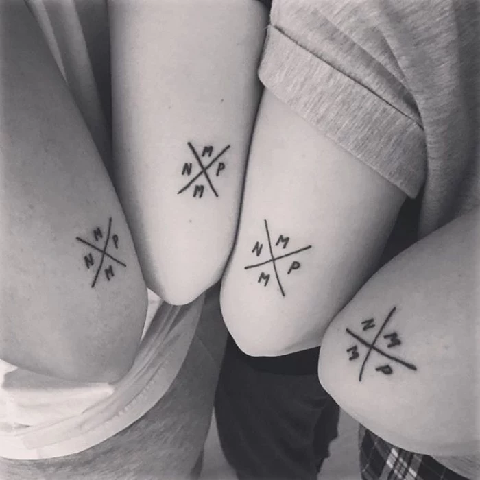 friendship tattoo ideas, above the elbow tattoos, letter initials, two lines crossed, black and white photo