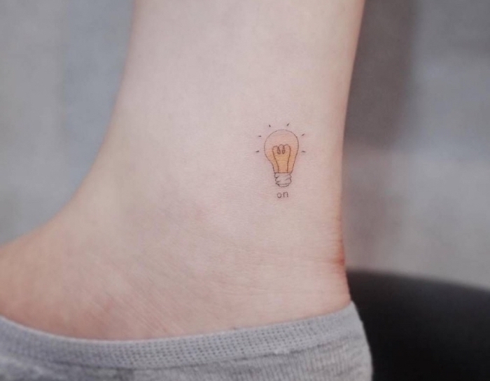 best places to get a tattoo, light bulb on, ankle tattoo, grey socks