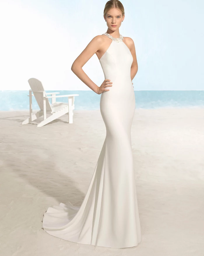 bohemian beach wedding dress, long satin dress, jewel neckline, blonde hair, in a low updo
