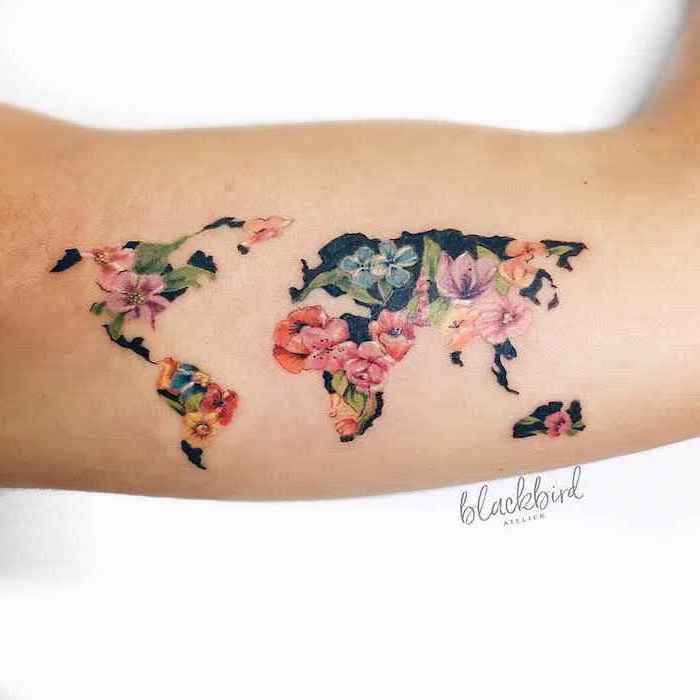 map of the world, floral motifs, watercolor lion tattoo, inside arm tattoo, white background