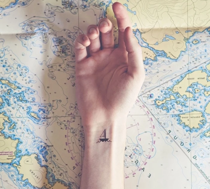 cute simple tattoos, map of the world, wrist tattoo
