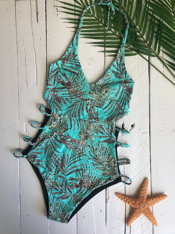 bikinis for girls, mint green, with leopard print palm leaves, one piece, wooden background