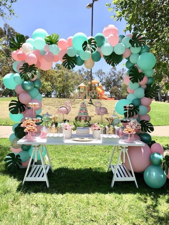 mint green and pink balloons, palm leaves, pink flamingos, cupcake stands, 16th birthday party ideas