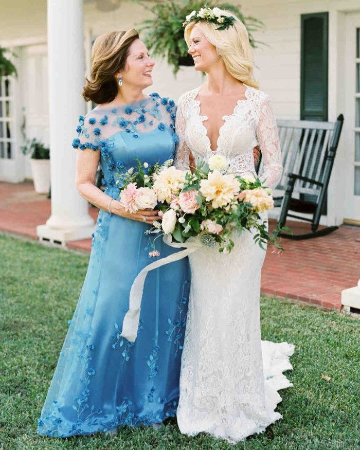 bride and mother, blue dress, navy blue mother of the bride dress, flower bouquet, brown and blonde hair