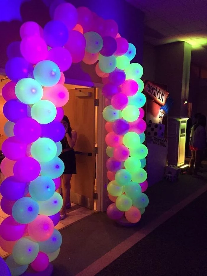 colourful neon, balloon arch, over a large door, what should i do for my birthday