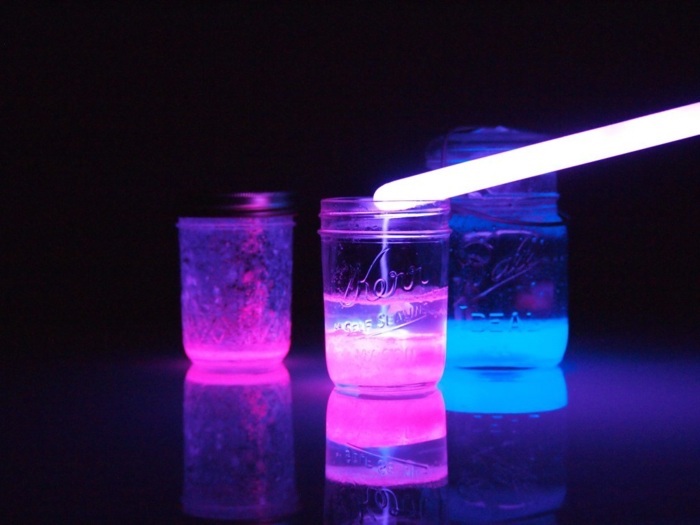 glow in the dark stick, glowing jars, diys for teens, blue and purple glow, on a black background