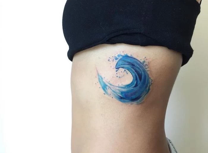 blue ocean wave, rib cage tattoo, watercolor rose tattoo, black top, white background