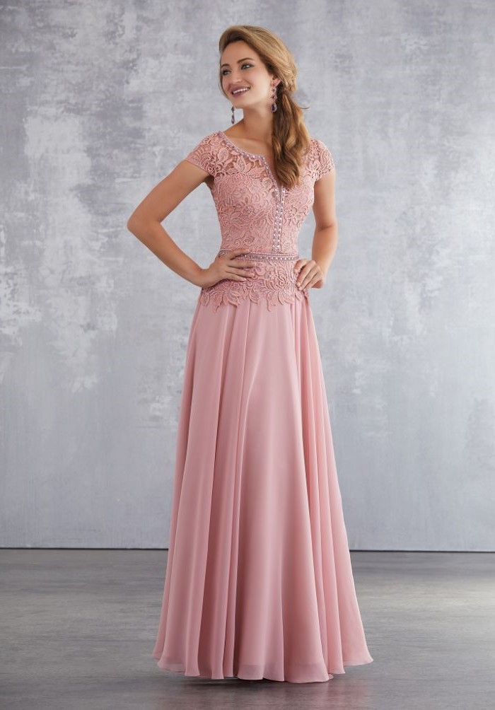 pink dress, lace top, chiffon skirt, mother of the bride outfits, long blonde hair, in a ponytail