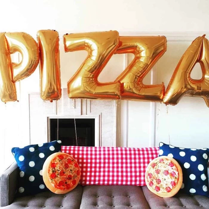 pizza party, gold balloons, summer party themes, pizza throw pillows, blue throw pillows, grey sofa