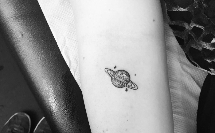 planet and stars, forearm tattoo, black and white photo, minimalistic tattoos, white paper
