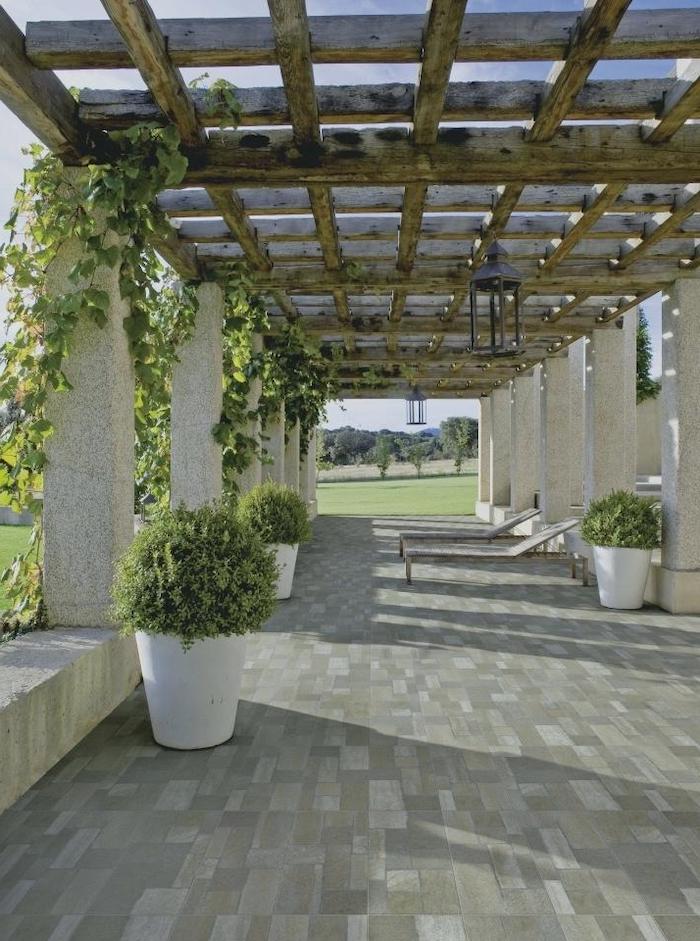 tiled pathway, potted plants, climbing plants, lounge chairs, screened in porch furniture