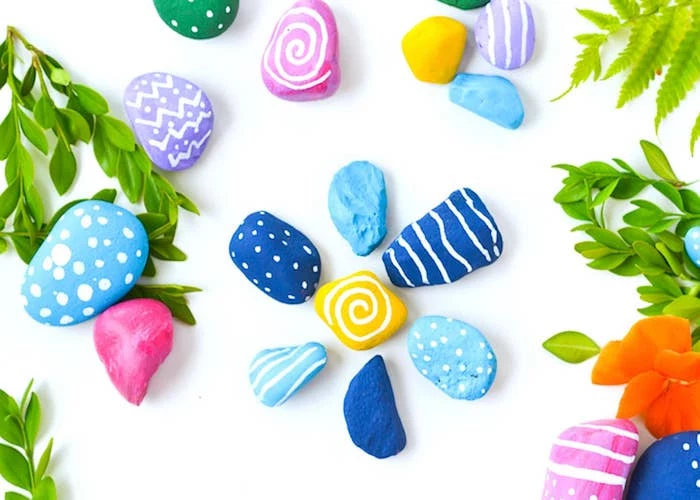 colourful rocks, blue and yellow, purple and pink, diy projects for teens, garden decoration