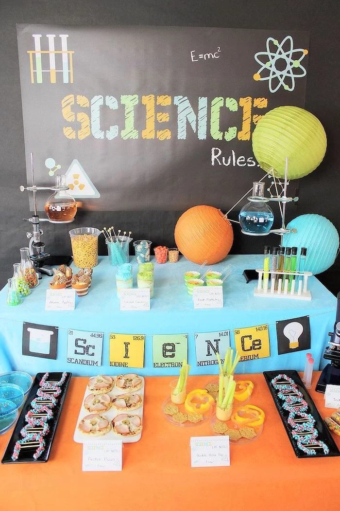science rules, theme party ideas, blue and orange decor, sweets and cookies, blue and orange juice
