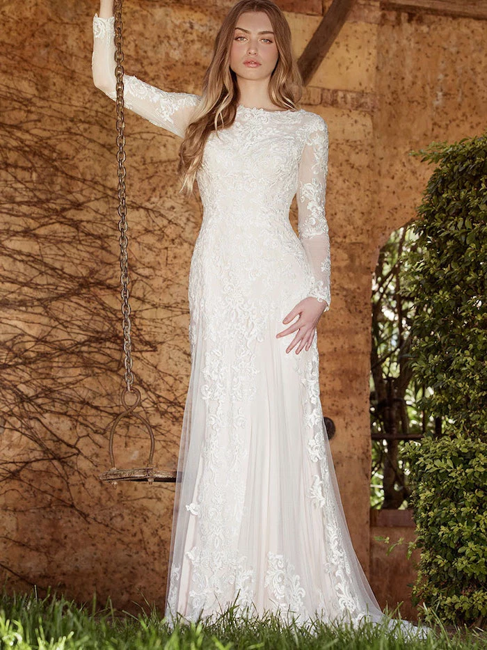 metal swing, blonde wavy hair, ball gown wedding dresses with sleeves, made of lace and chiffon