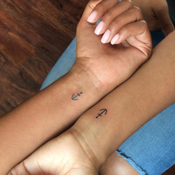 best friend symbol tattoos, small anchors, wrist tattoos, wooden floor