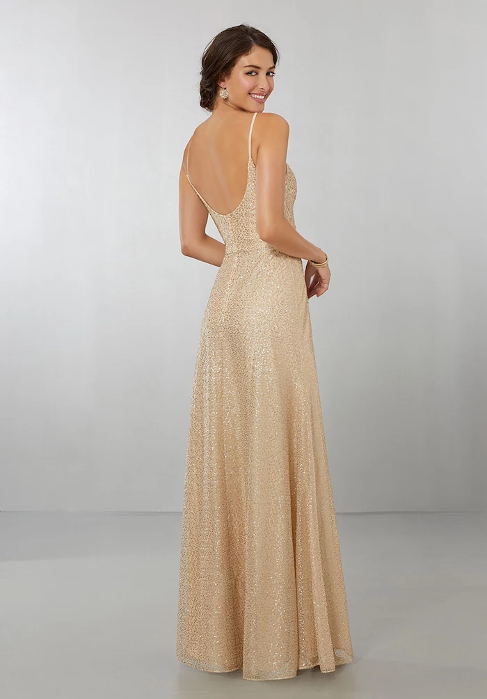 long gold dress, bare back, spaghetti straps, long sleeve bridesmaid dresses, brown hair, in a low updo
