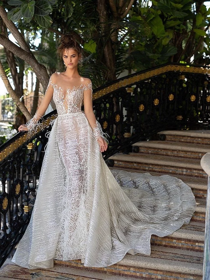 bell sleeve wedding dress, off shoulder, woman on a staircase, brown hair, in a messy bun
