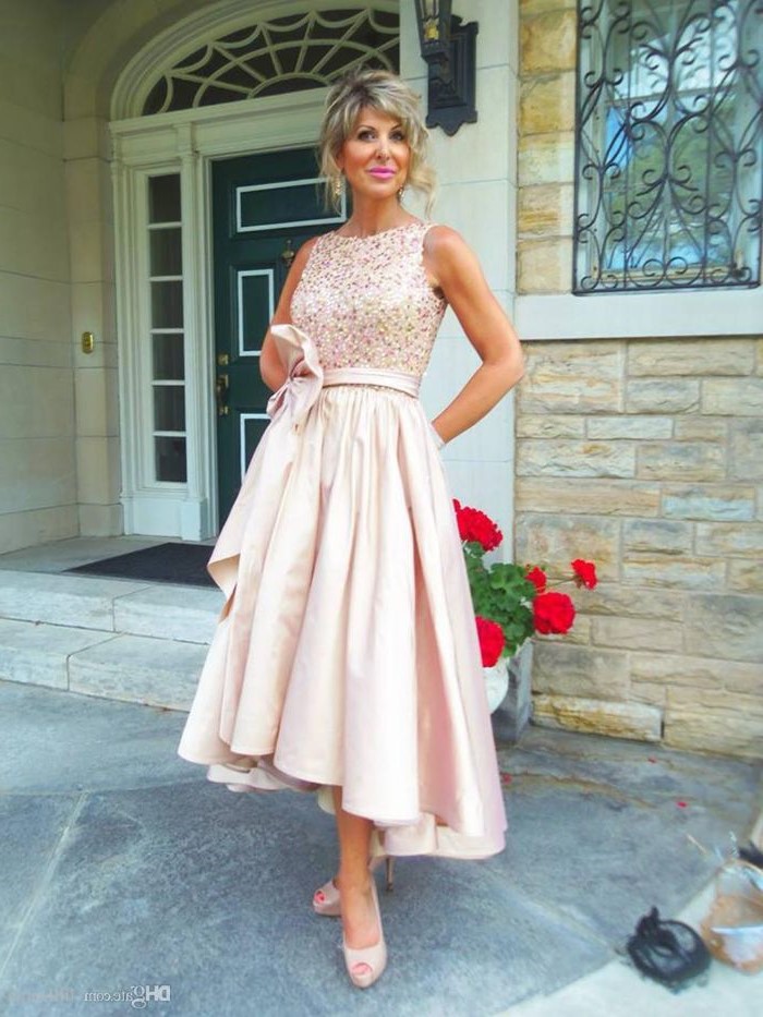 blonde hair, in a low updo, asymmetrical dress, lace mother of the bride dresses, nude open toe heels