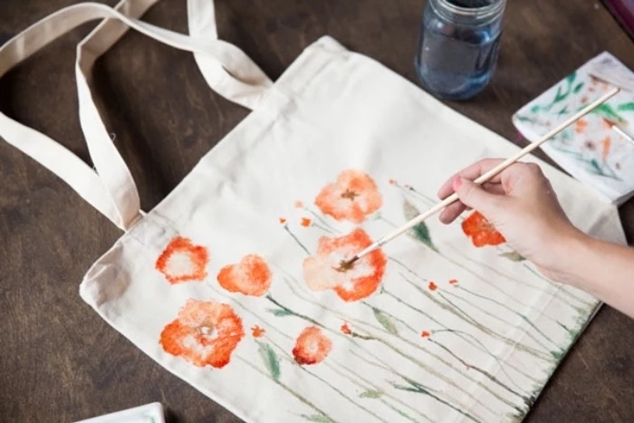white tote bag, field flowers, drawn on it, easy diys for kids, wooden table
