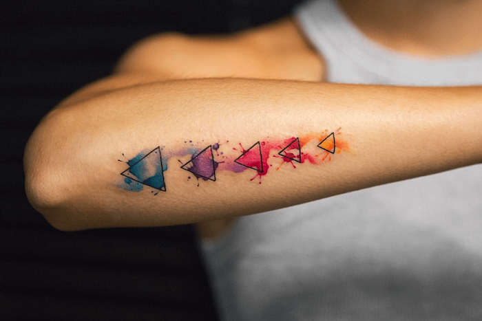 five triangles, back of arm, watercolor butterfly tattoo, white top