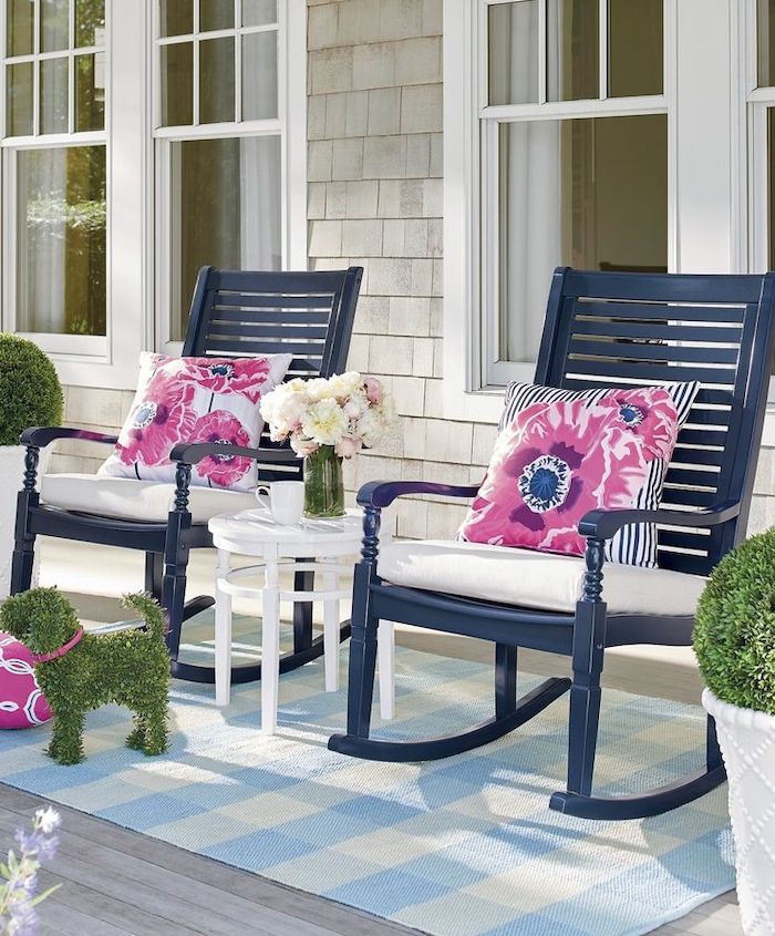 blue rocking chairs, pink and blue throw pillows, blue and white rug, screened in porch ideas, flower bouquets